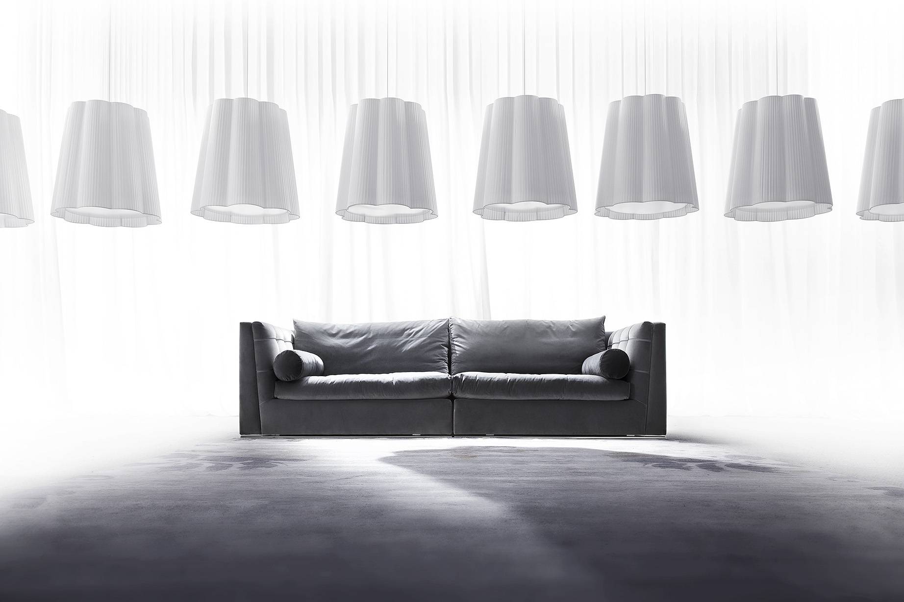 getback-1-sofa-tufted-roll-pillows-soft-livingoom-couch-fiore-lamp-ligths-italian-interior-design-handmade-capitonne-quilting-upholstery-craft-erba-italia-heritage-erba-idea-erbaidea